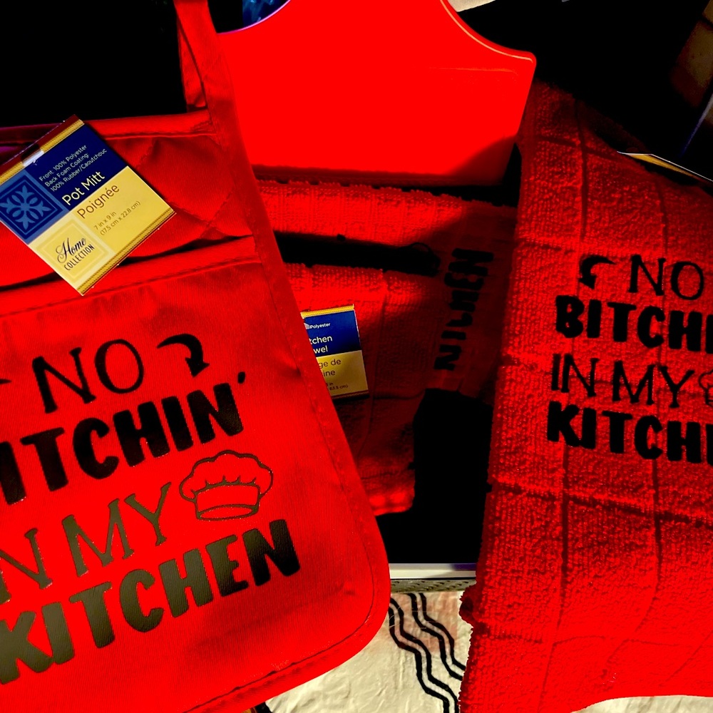 Kitchen towels, hand mitts, cutting board, wash clothes and basket